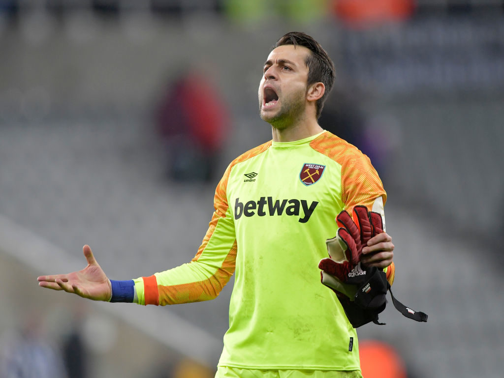 Lukasz Fabianski of West Ham United celebrates a clean sheet and an away victory following the Premier League match between Newcastle United and We...