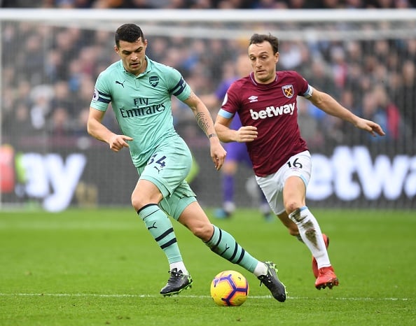 West Ham skipper Mark Noble leaps to the defence of Arsenal's Granit Xhaka