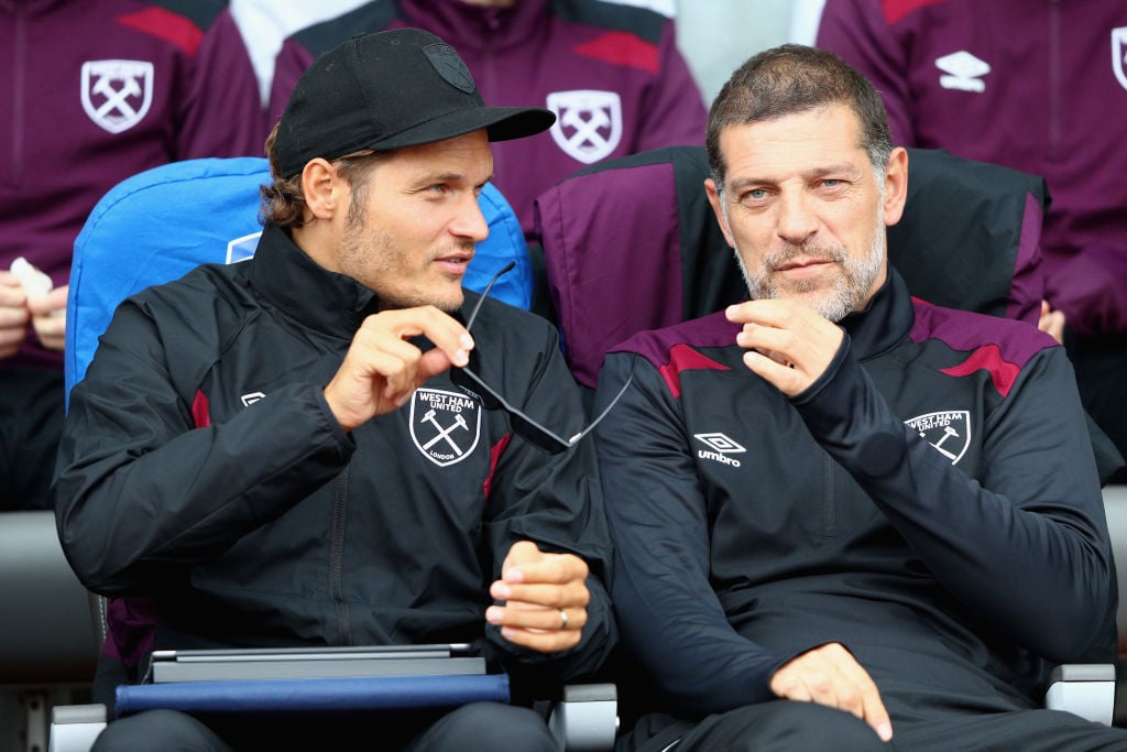 Slaven Bilic, Manager of West Ham United (R) speaks to Edin Terzic, West Ham United first team coach (L) prior to a Pre Season Friendly between Man...