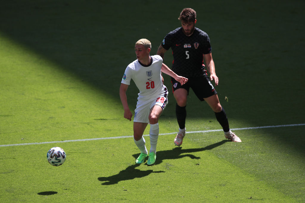 Phil Foden of England is challenged by Duje Caleta-Car of Croatia during the UEFA Euro 2020 Championship Group D match between England and Croatia ...