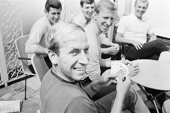 Bobby Charlton holds a full house in a game of cards with team mates, l-r Peter Bonetti, Martin Peters, Jack Charlton an