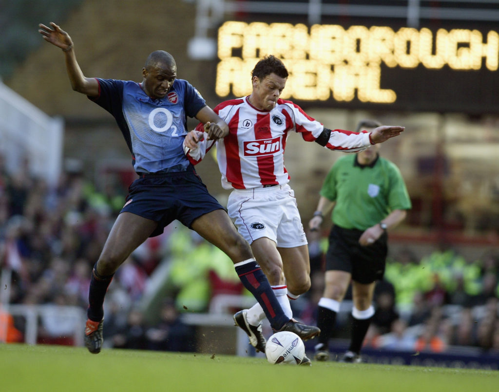 Patrick Vieira of Arsenal tackles Steve Watson of Farborough Town