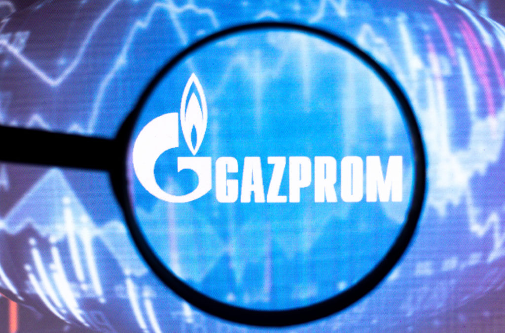 In this photo illustration, a Gazprom logo seen displayed on