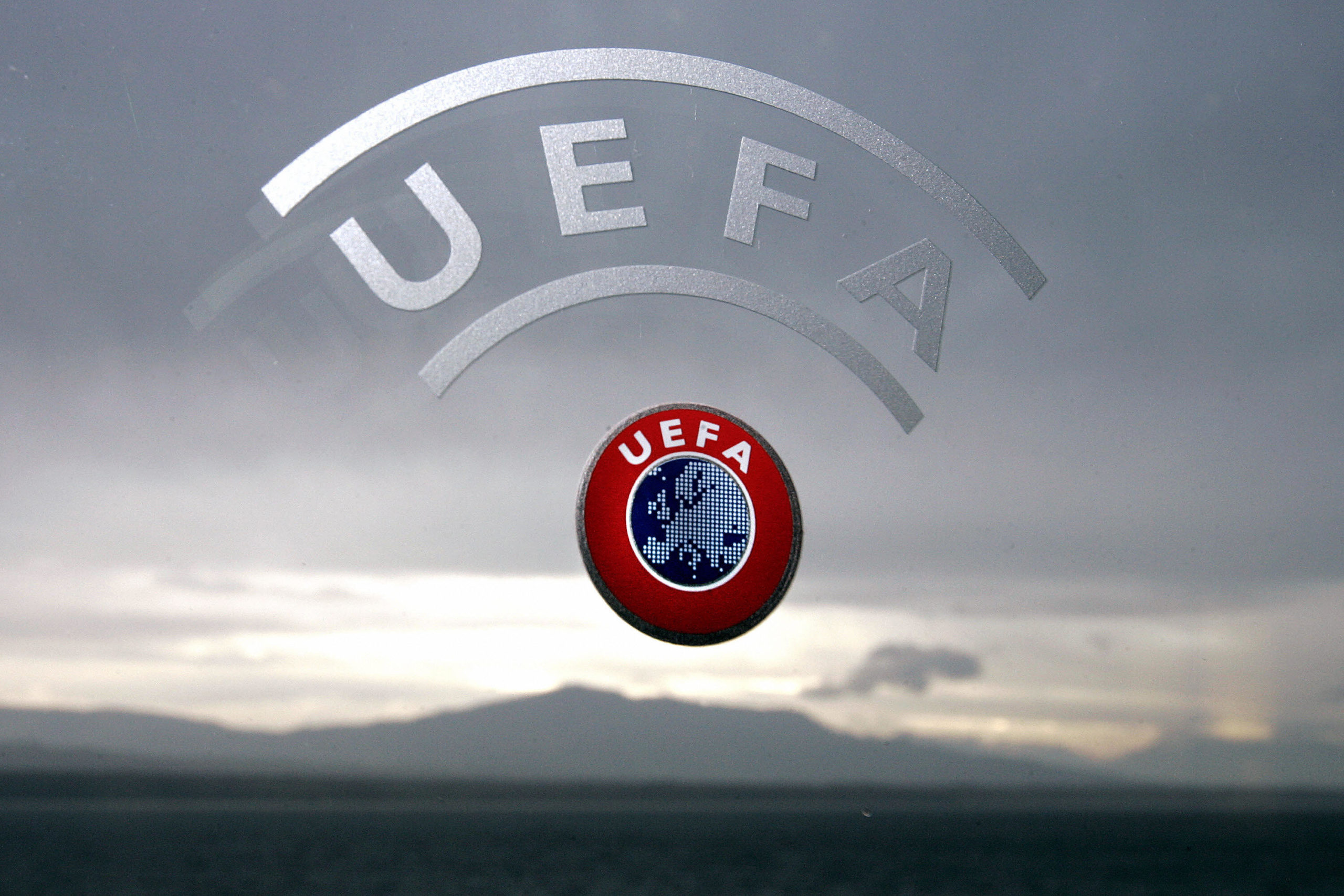 A UEFA logo is seen with Geneva Lake and