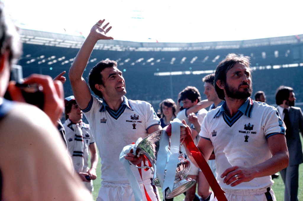 Football. F.A.Cup Final. 10th May 1980. Wembley Stadium, London. West Ham United 1 v Arsenal 0. West Ham United goalscorer, Trevor Brooking (left) celebrating with team-mate Frank Lampard as they parade the trophy.