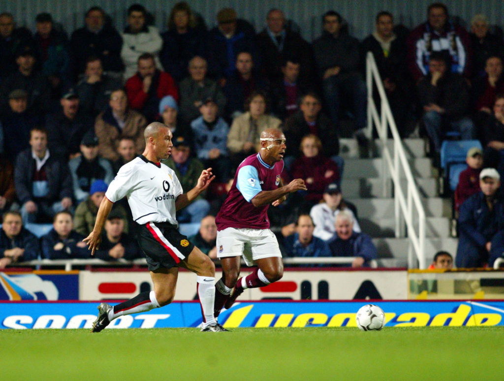 Trevor Sinclair of West Ham and Mikael Silvestre of Manchester United