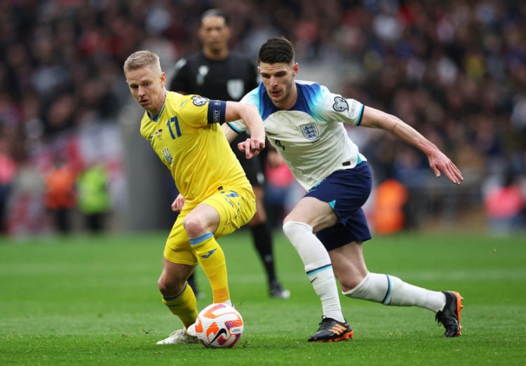 Arsenal's Oleksandr Zinchenko seems to like what he hears after appearing to proposition West Ham captain Declan Rice following clash