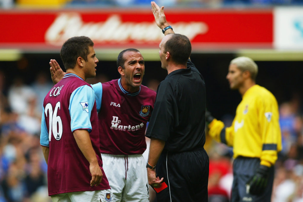Paolo Di Canio of West Ham United argues with referee Mike Dean