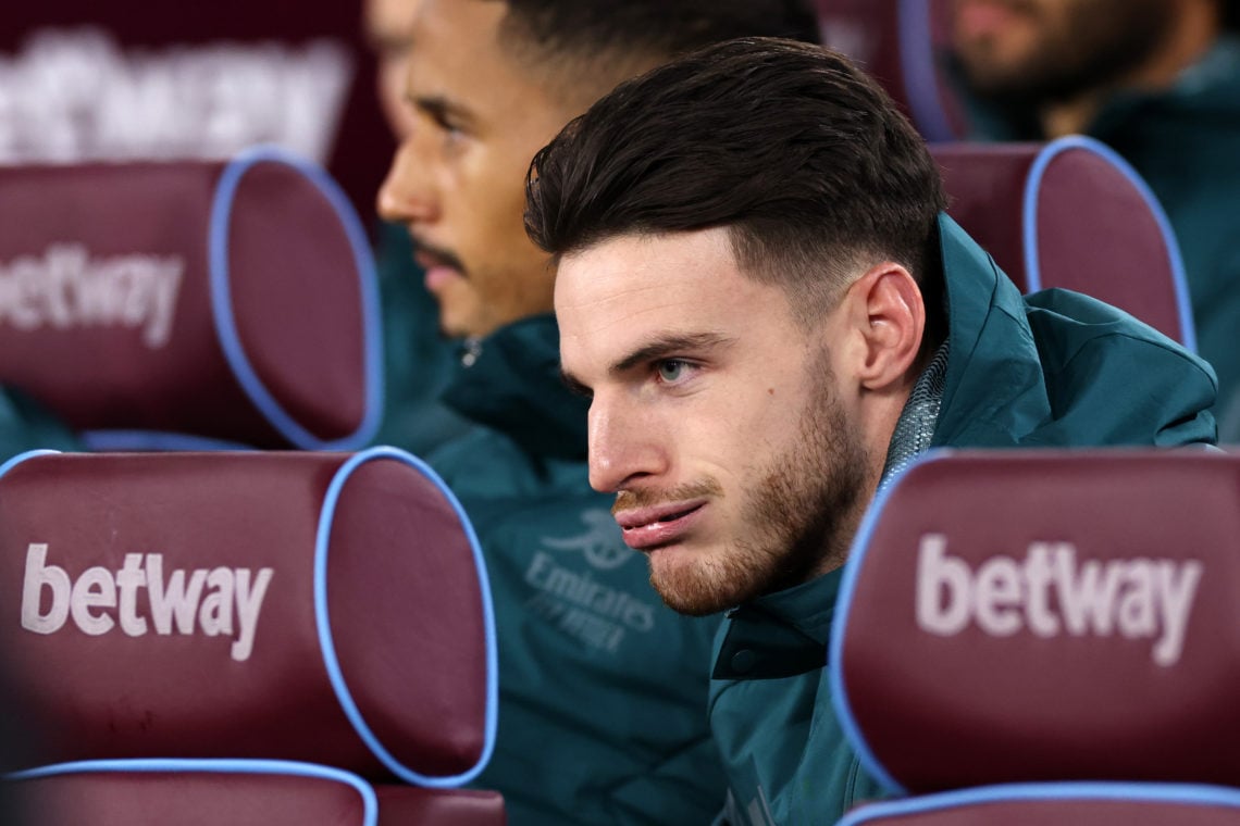 Declan Rice of Arsenal reacts as he sits on the substitutes bench during the Carabao Cup Fourth Round match between West Ham United and Arsenal at ...