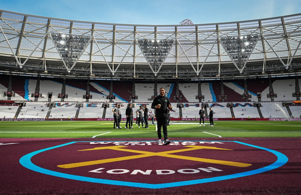 Callum Wilson walks across the West Ham badge at the London Stadium