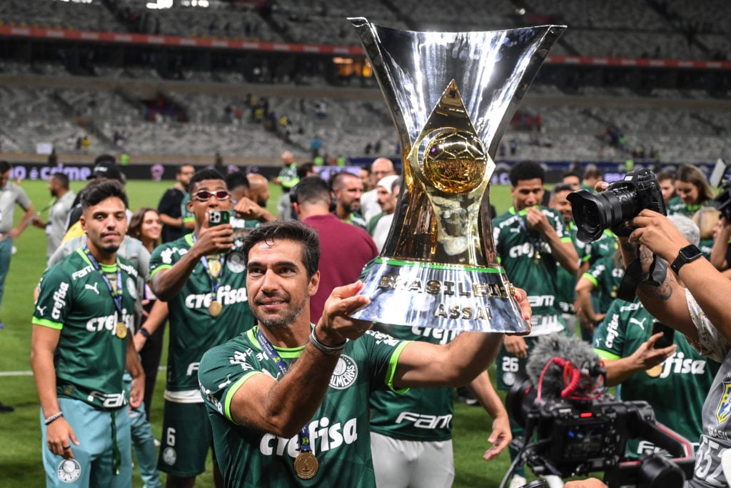 Abel Ferreira coach of Palmeiras celebrates with the trophy after winning the match between Cruzeiro and Palmeiras as part of Brasileirao 2023 at M...