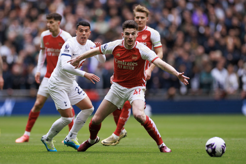 Pedro Porro of Tottenham Hotspur  in action with Declan Rice of Arsenal during the Premier League match between Tottenham Hotspur and Arsenal FC at...