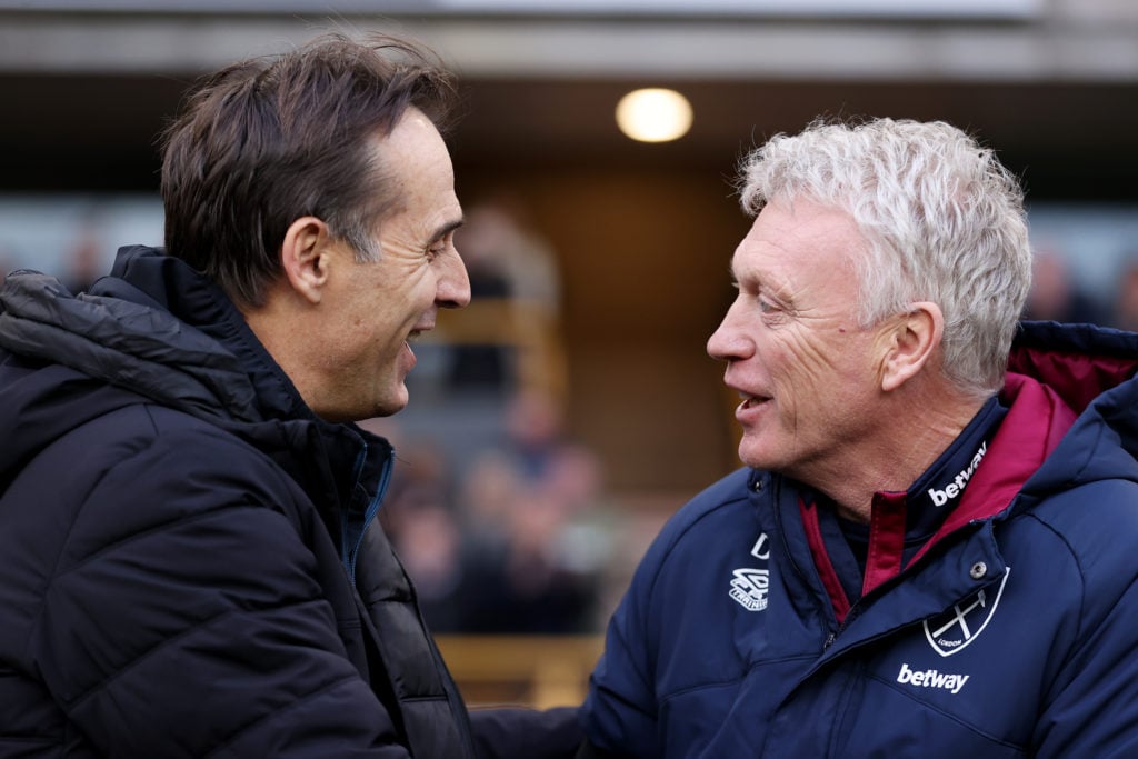 Julen Lopetegui, Manager of Wolverhampton Wanderers (L) embraces David Moyes, Manager of West Ham United ahead of the Premier League match between ...