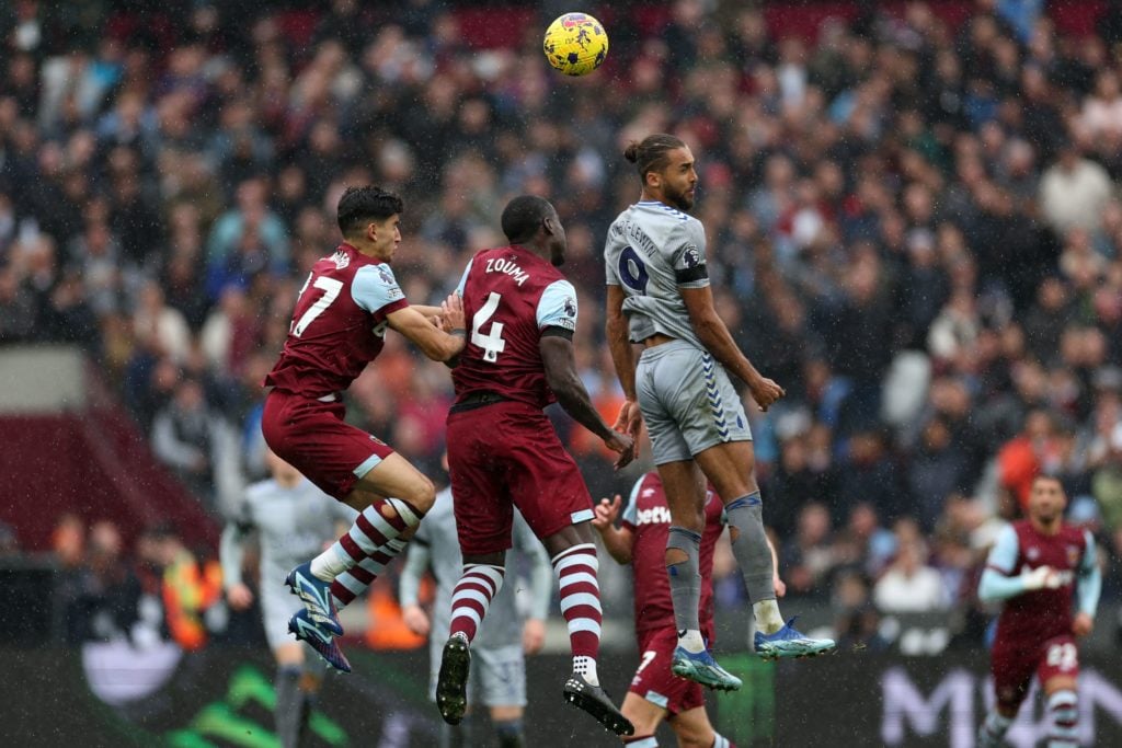 Everton's English striker #09 Dominic Calvert-Lewin (R) jumps wih West Ham United's Moroccan defender #27 Nayef Aguerd (L) and West Ham United's Fr...