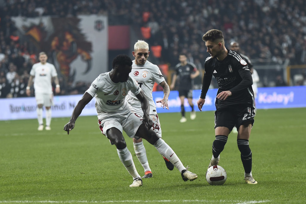Ernest Muçi (R) of Besiktas and Davinson Sanchez (6) , Lucas Torreira (34) of Galatasaray battle for the ball during the Turkish Super League match...