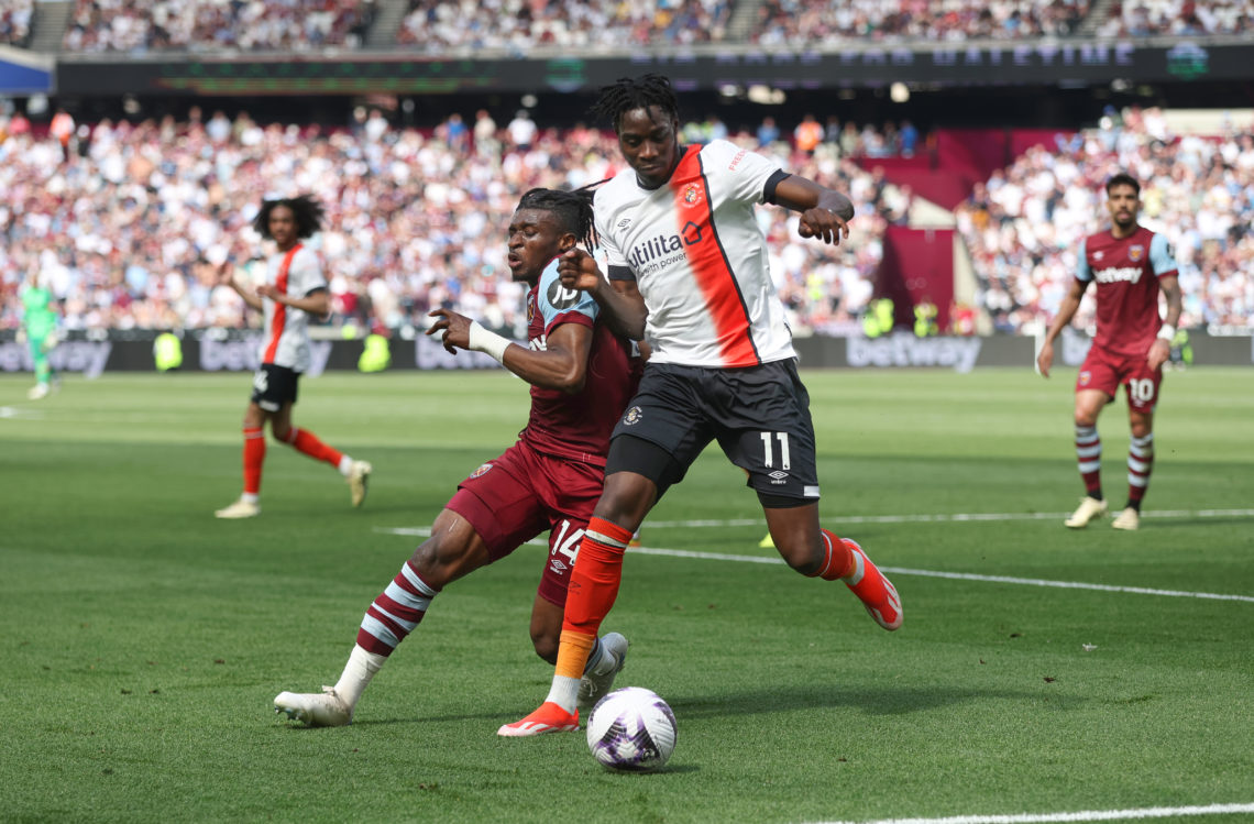 West Ham United's Mohammed Kudus and Luton Town's Elijah Adebayo during the Premier League match between West Ham United and Luton Town at London S...