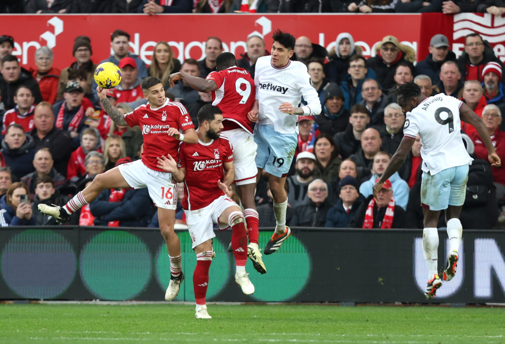 West Ham United's Edson Alvarez heads clear under pressure from Nottingham Forest's Taiwo Awoniyi, Felipe and Nicolas Dominguez during the Premier ...