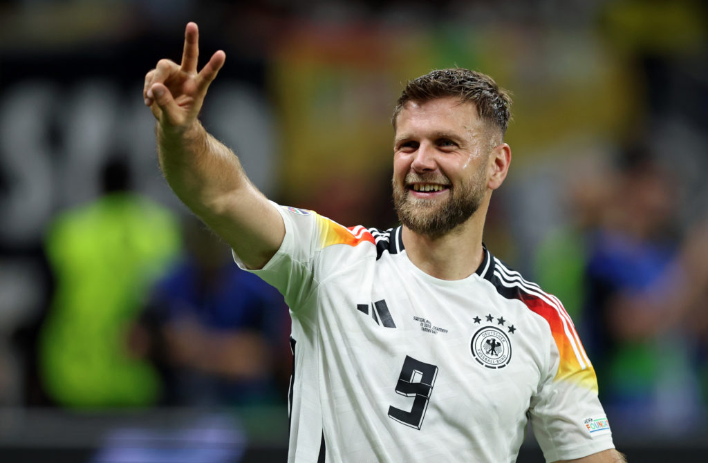 Niclas Füllkrug of Germany celebrate with the fans after their sides victory the UEFA EURO 2024 group stage match between Switzerland and Germany a...