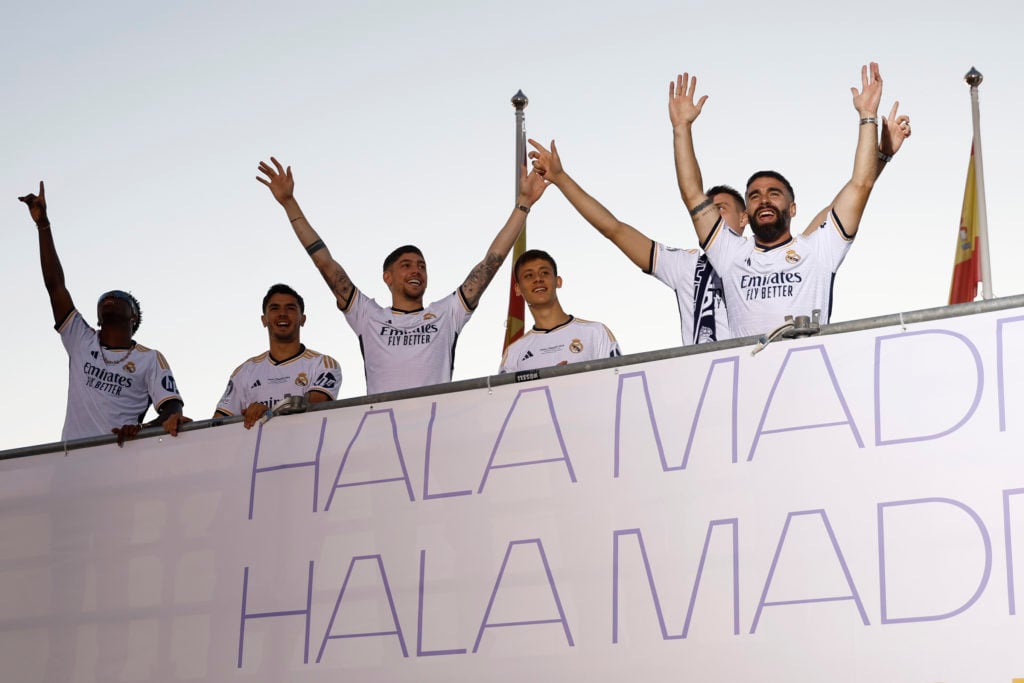 Real Madrid players celebrate the Champions League trophy on June 2, 2024 in Madrid, Spain.