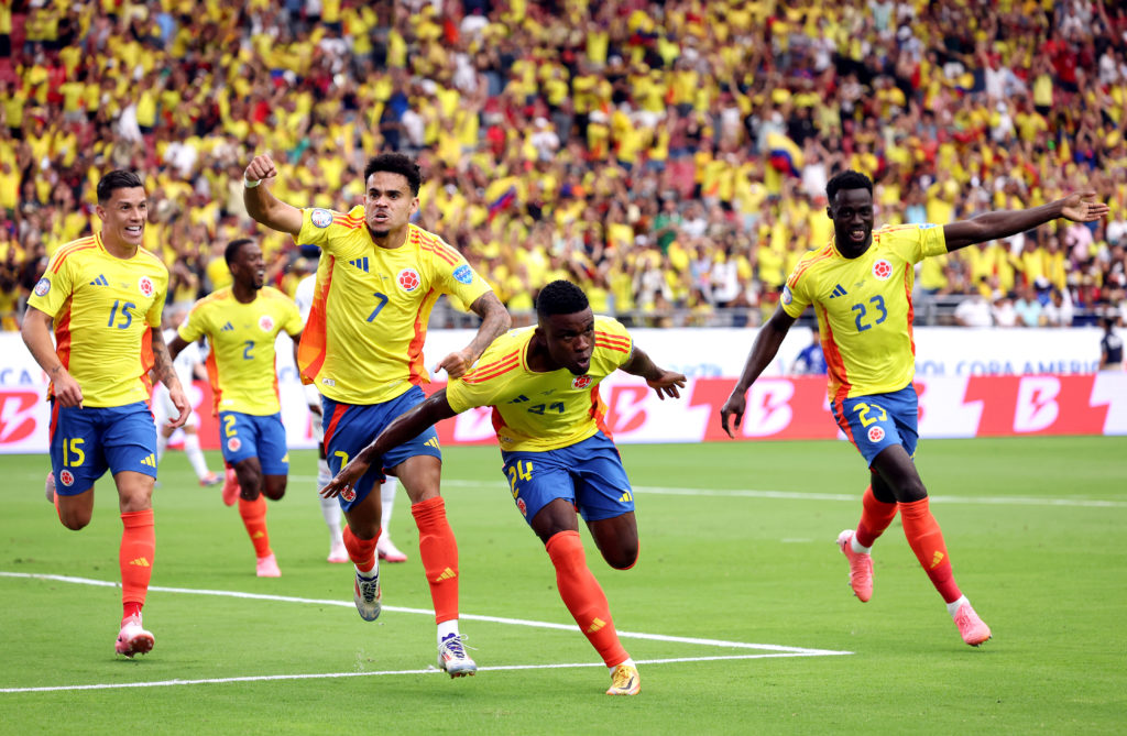 Jhon Cordoba #24 of Colombia celebrates with teammates after scoring during the CONMEBOL Copa America 2024 quarter-final match between Colombia and...