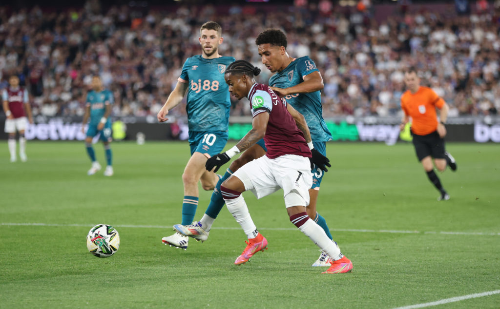 West Ham United's Crysencio Summerville is challenged by Bournemouth's James Hill during the Carabao Cup Second Round match between West Ham United...