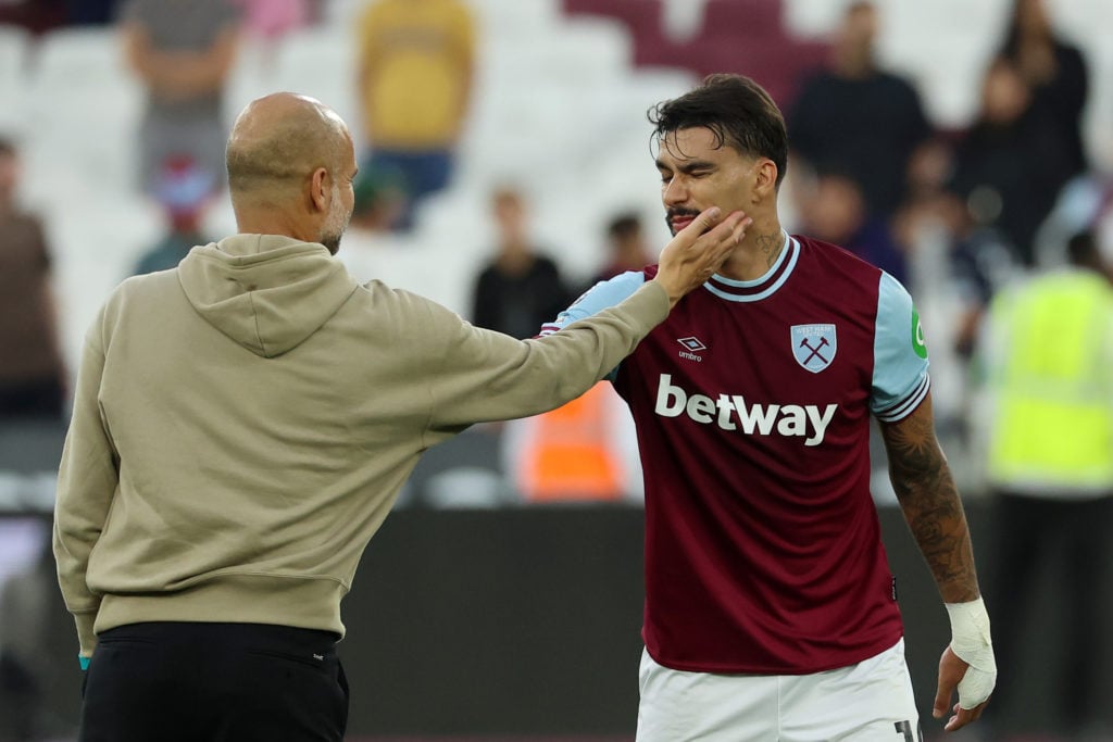 Lucas Paqueta of West Ham United interacts with Pep Guardiola, Manager of Manchester City, after the Premier League match between West Ham United F...