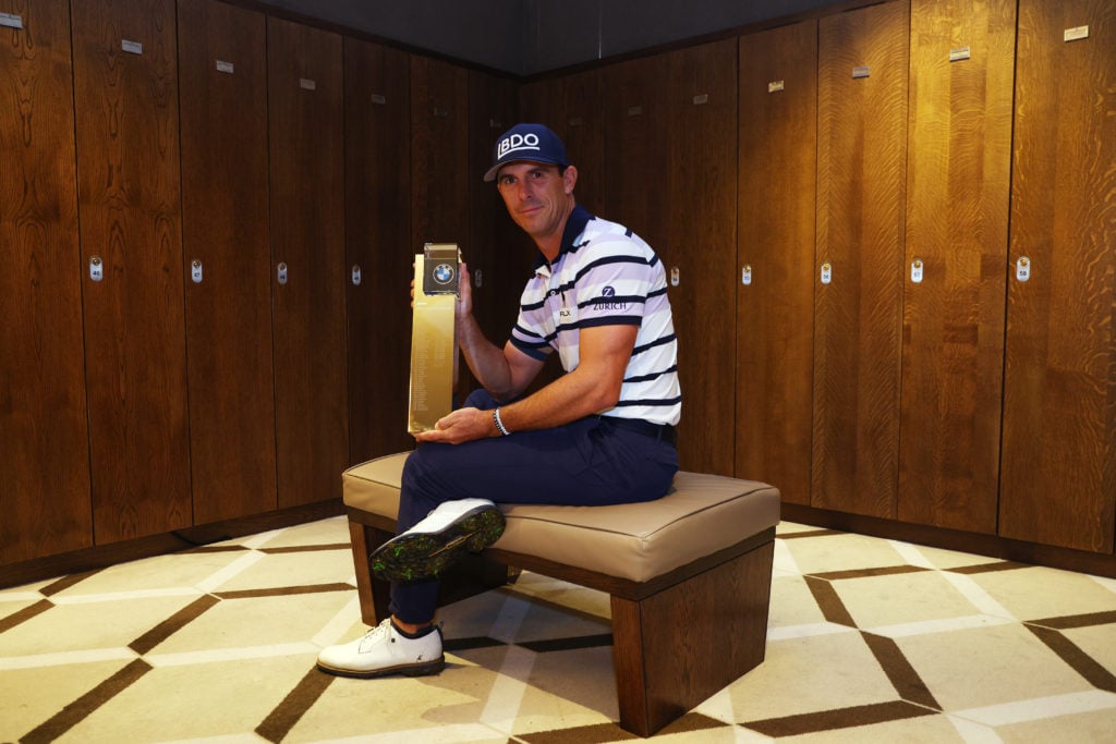 Billy Horschel of the United States poses for a photo with the trophy in the locker room following day four of the BMW PGA Championship 2024 at Wen...