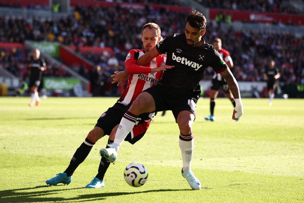 Brentford's Danish midfielder #24 Mikkel Damsgaard (L) vies with West Ham United's Brazilian midfielder #10 Lucas Paqueta during the English Premie...