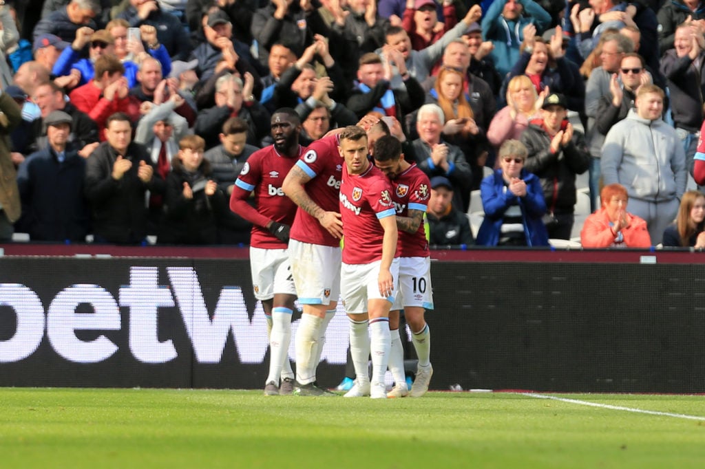 Marko Arnautovic of West Ham United celebrates scoring his sides second goal with team mates during the Premier League match between West Ham Unite...