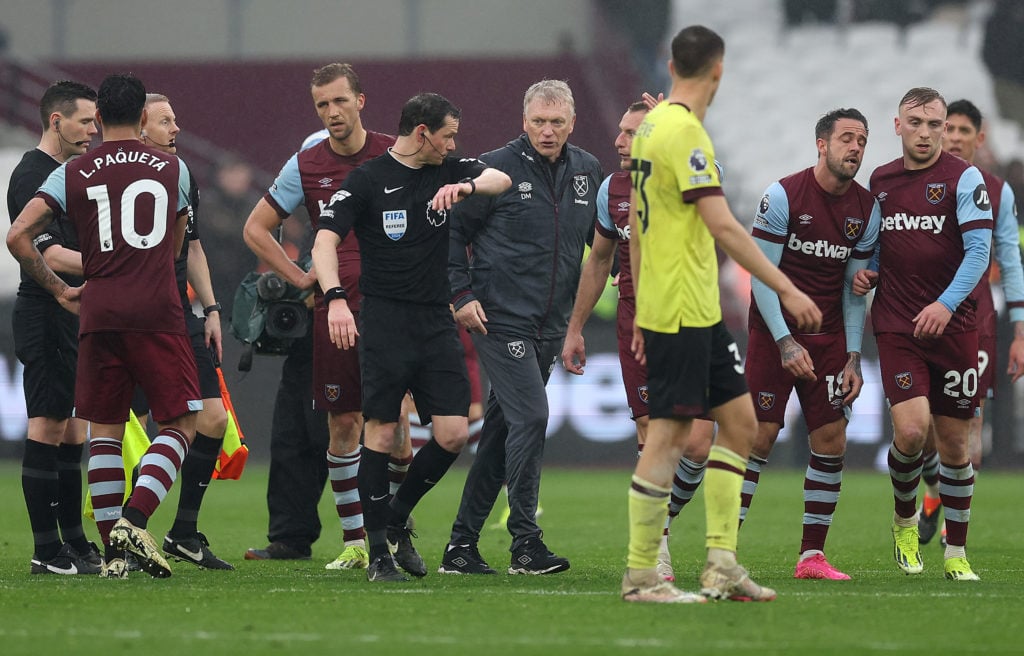 David Moyes, Manager of West Ham United, speaks with Referee Darren England after the Premier League match between West Ham United and Burnley FC a...