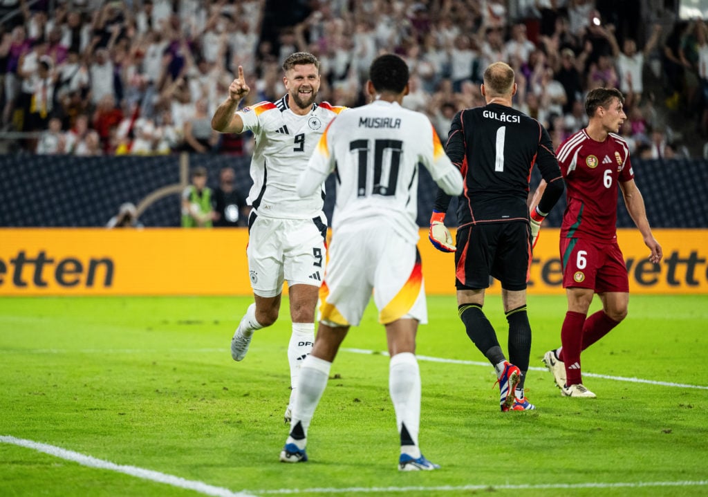 The Germany team with Jamal Musiala (10) and goalscorer Niclas Fuellkrug celebrates the team's first goal during the UEFA Nations League 2024/25.