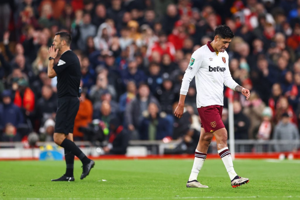 Edson Alvarez of West Ham United reacts after being sent off during the Carabao Cup Third Round match between Liverpool and West Ham United at Anfi...