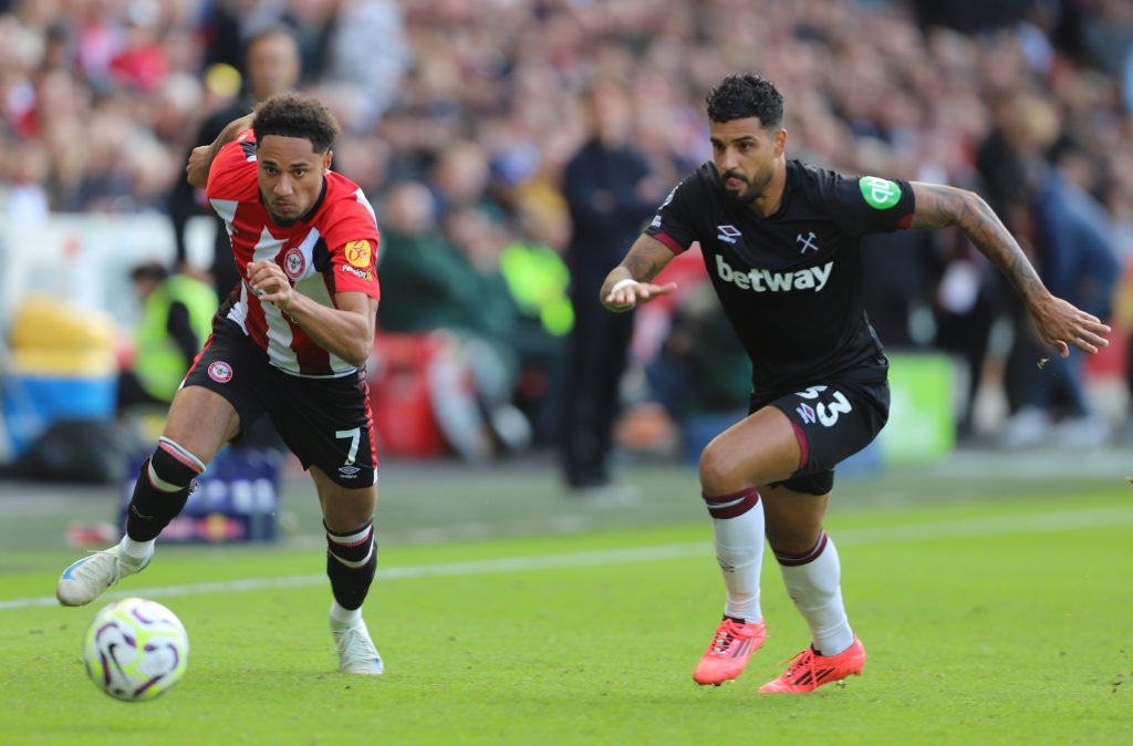 Emerson Palmieri of West Ham chases Brentford's Kevin Schade during the Premier League match between Brentford and West Ham United at the Gtech Com...