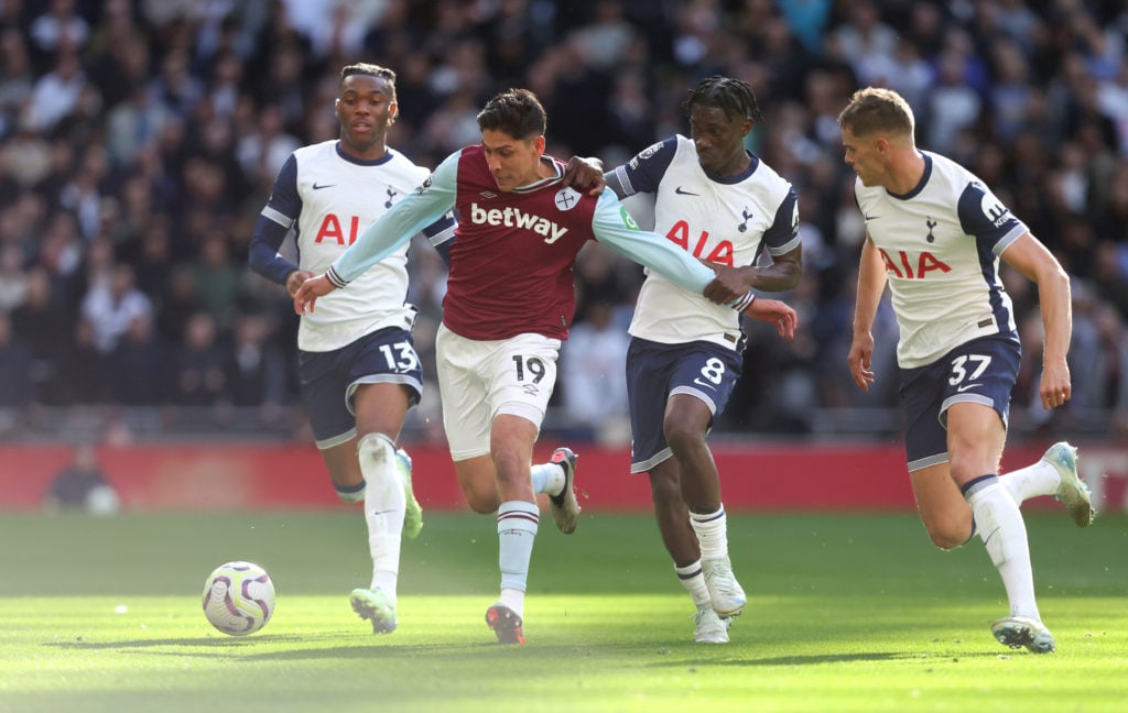 West Ham United's Edson Alvarez gets away from Tottenham Hotspur's Yves Bissouma, Destiny Udogie and Micky van de Ven during the Premier League mat...