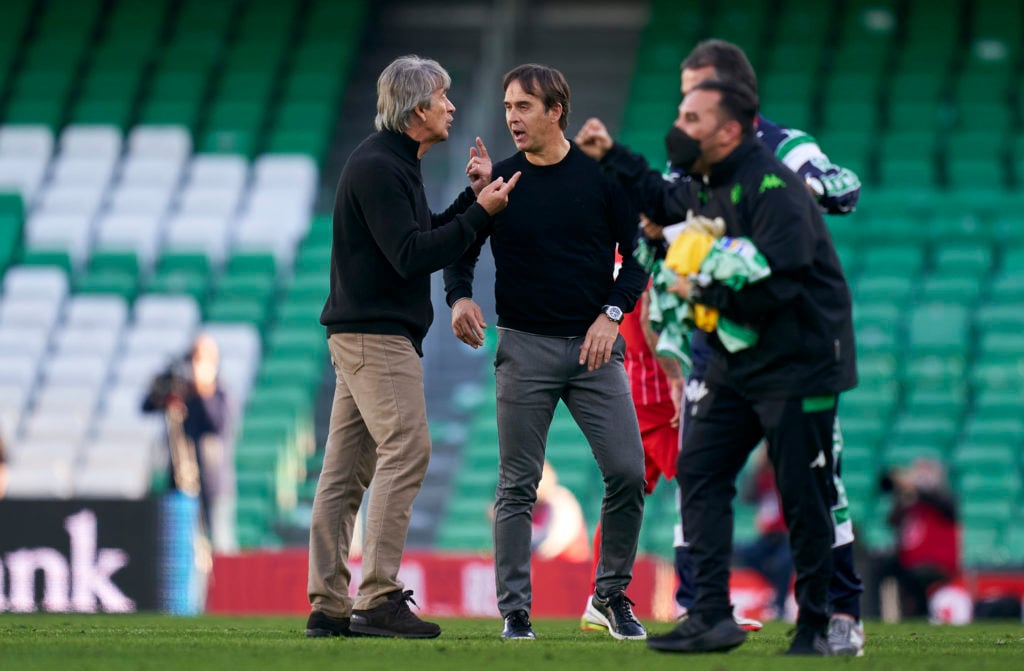 Manuel Pellegrini, Manager of Real Betis talks with Julen Lopetegui, Manager of Sevilla FC after the Copa Del Rey round of 16 match between Real Be...