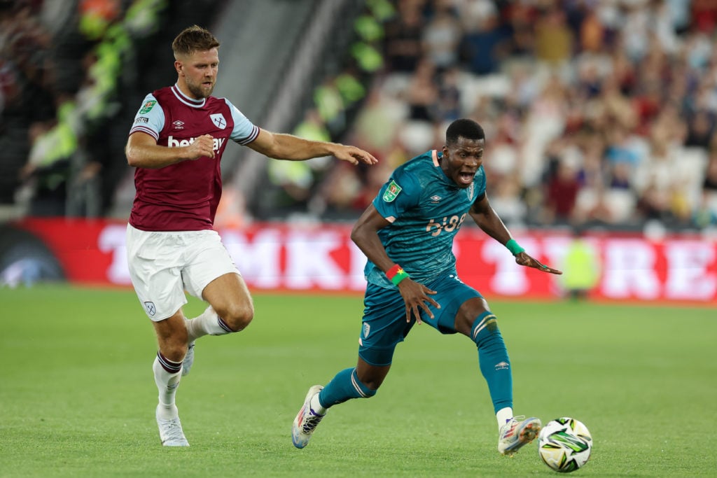 Dango Ouattara of AFC Bournemouth runs with the ball whilst under pressure from Niclas Fuellkrug of West Ham United during the Carabao Cup Second R...