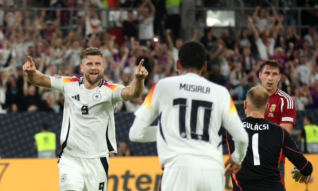 Niclas Fullkrug of Germany celebrates scoring his team's first goal with teammate Jamal Musiala  during the UEFA Nations League 2024/25 League A Gr...