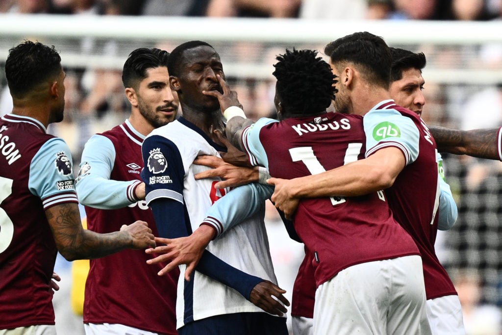 Mohammed Kudus of West Ham United is hit in the face by Pape Matar Sarr of Tottenham Hotspur FC resulting in a red card for Kudus during the Premie...