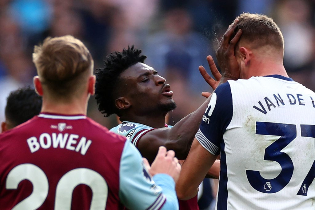 Mohammed Kudus of West Ham United clashes with Micky van de Ven of Tottenham Hotspur and is subsequently shown a Red card during the Premier League...