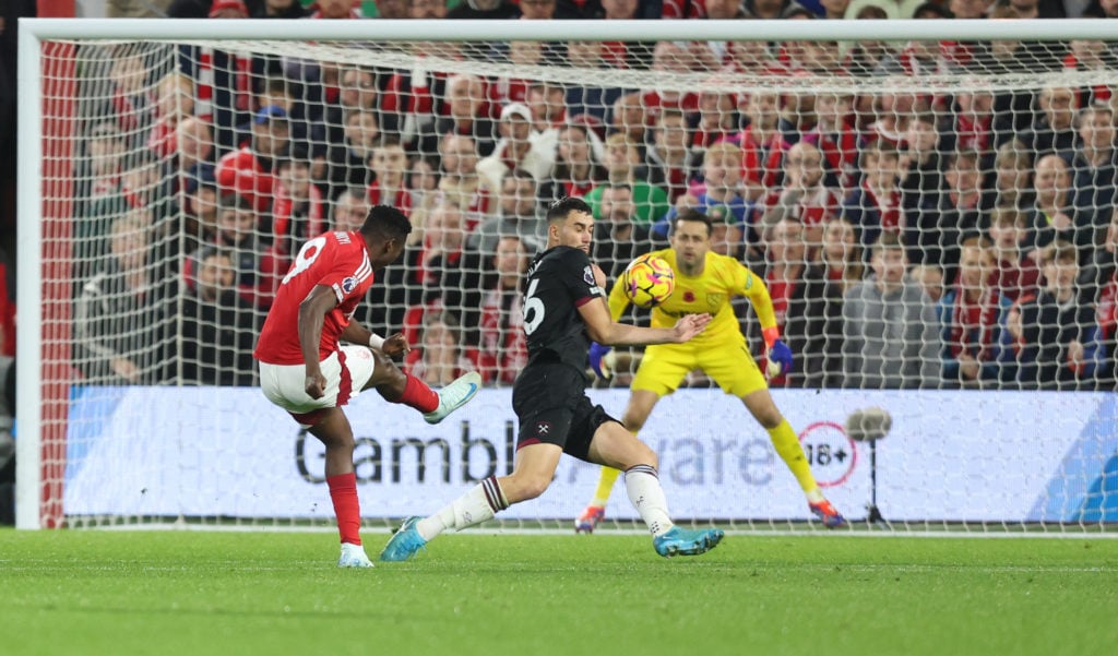 Nottingham Forest's Taiwo Awoniyi with a shot under pressure from West Ham United's Max Kilman during the Premier League match between Nottingham F...