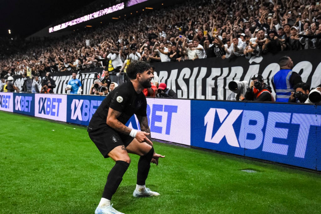 Yuri Alberto of Corinthians (L) celebrates near fans after scoring the second goal of his team during the Brasileirao 2024 match between Corinthian...