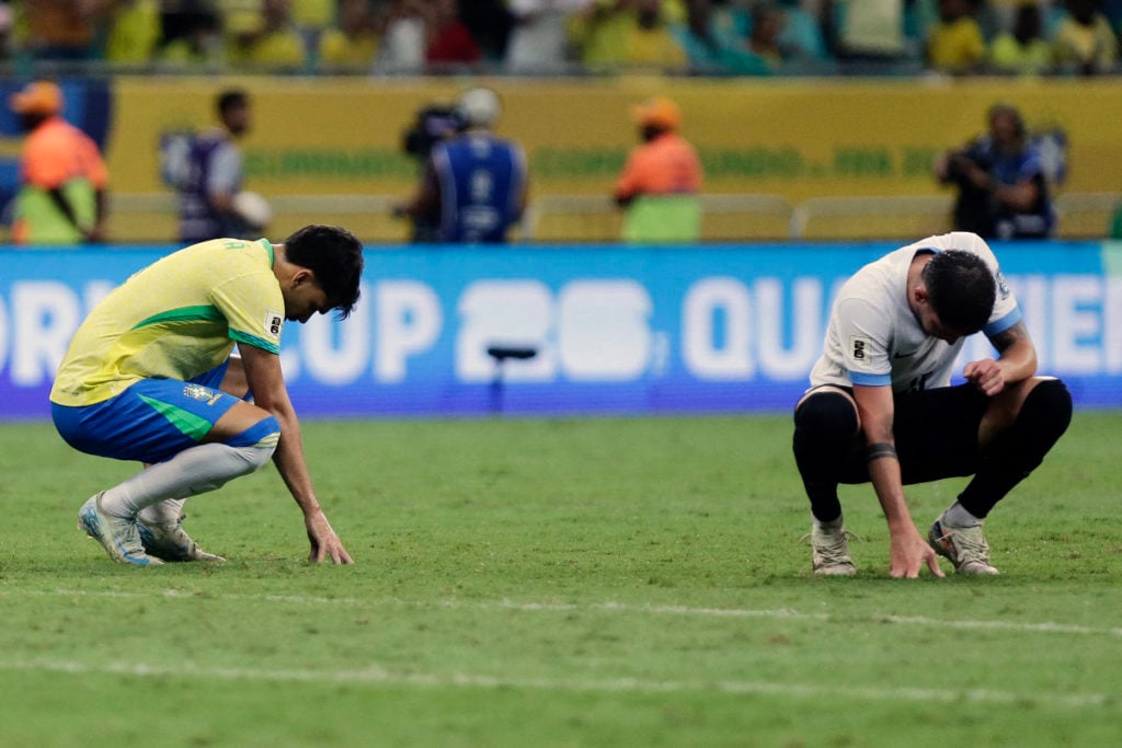 Brazil's midfielder #08 Lucas Paqueta and Uruguay's midfielder #15 Federico Valverde react during the 2026 FIFA World Cup South American qualifiers...