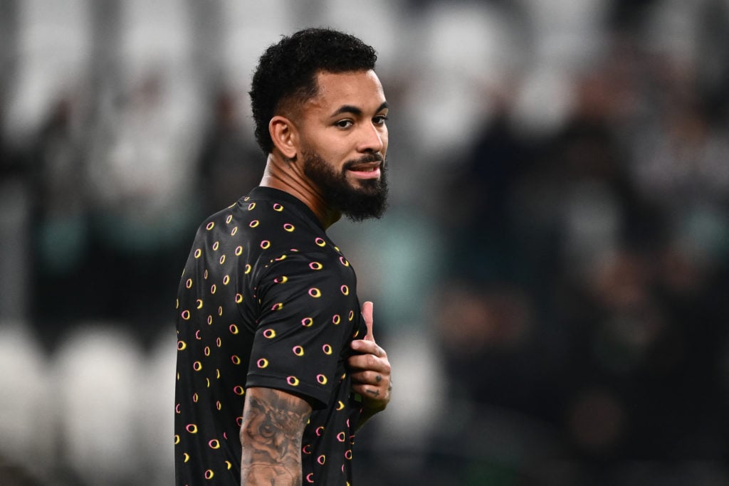 Douglas Luiz warms up before Juventus' game against Stuttgart