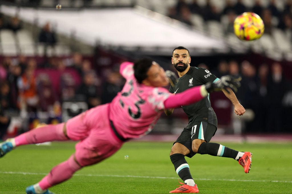 Liverpool's Egyptian striker #11 Mohamed Salah looks on as West Ham United's French goalkeeper #23 Alphonse Areola saves his shot during the Englis...