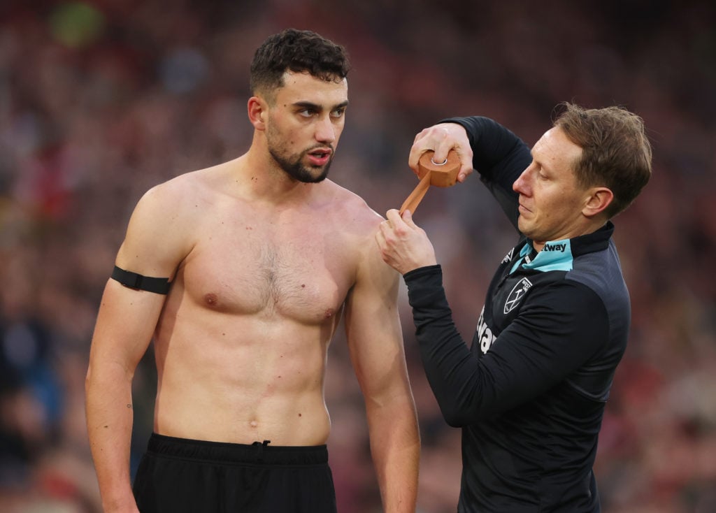 Max Kilman of West Ham United receives medical treatment during the Premier League match between Southampton FC and West Ham United FC at St Mary's...