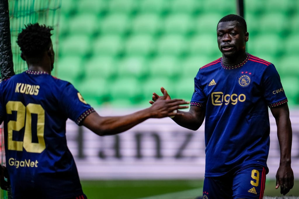 Brian Brobbey of Ajax celebrates with Mohammed Kudus of Ajax after scoring his sides second goal during the Eredivisie match between FC Groningen a...