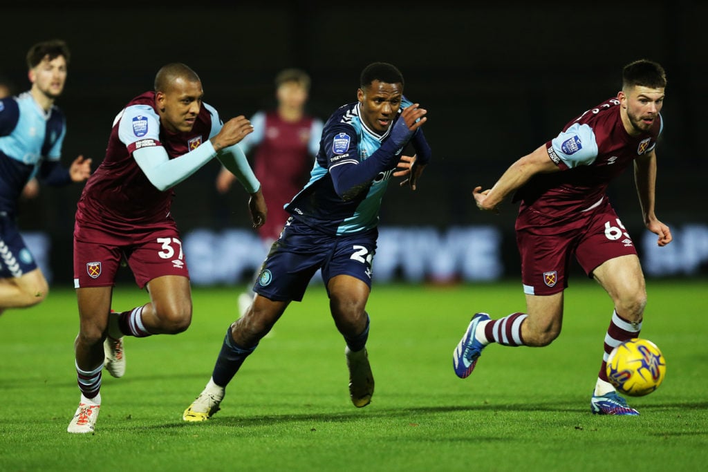 Richard Kone of Wycombe Wanderers battles for possession with Luizao and Michael Forbes of West Ham United during the Bristol Street Motors Trophy ...