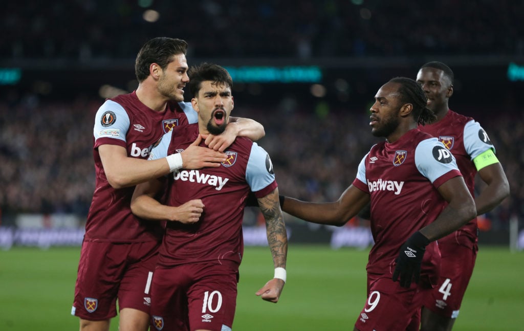 West Ham United's Lucas Paqueta celebrates scoring his side's first goal with Konstantinos Mavropanos and Michail Antonio during the UEFA Europa Le...