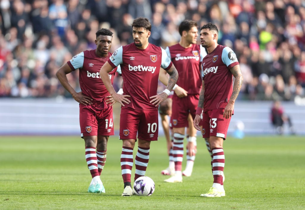 West Ham United's Lucas Paqueta, Mohammed Kudus and Emerson Palmieri deliberate over a free-kick during the Premier League match between West Ham U...