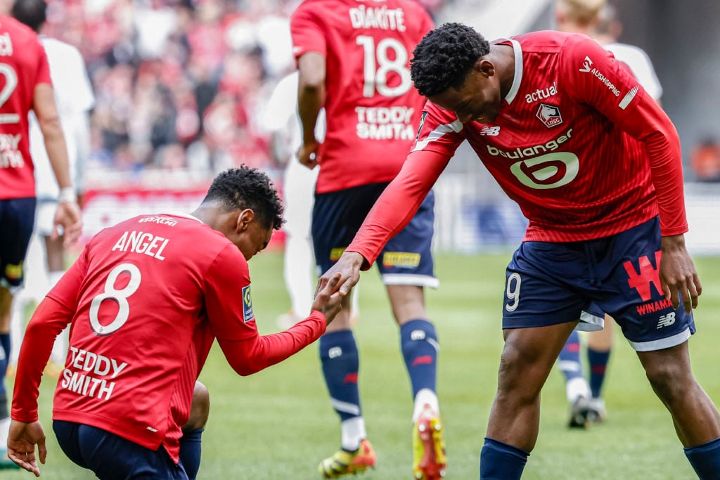 Lille's Canadian forward #09 Jonathan David (R) celebrates after scoring his team's first goal with his teammate Lille's English midfielder #08 Ang...